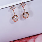 [Luxe]Boucles d'oreilles pendantes en nacre or rose étoile et soleil